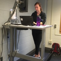 Natalie transcribing interviews while on the walkstation in Rosenau Hall.